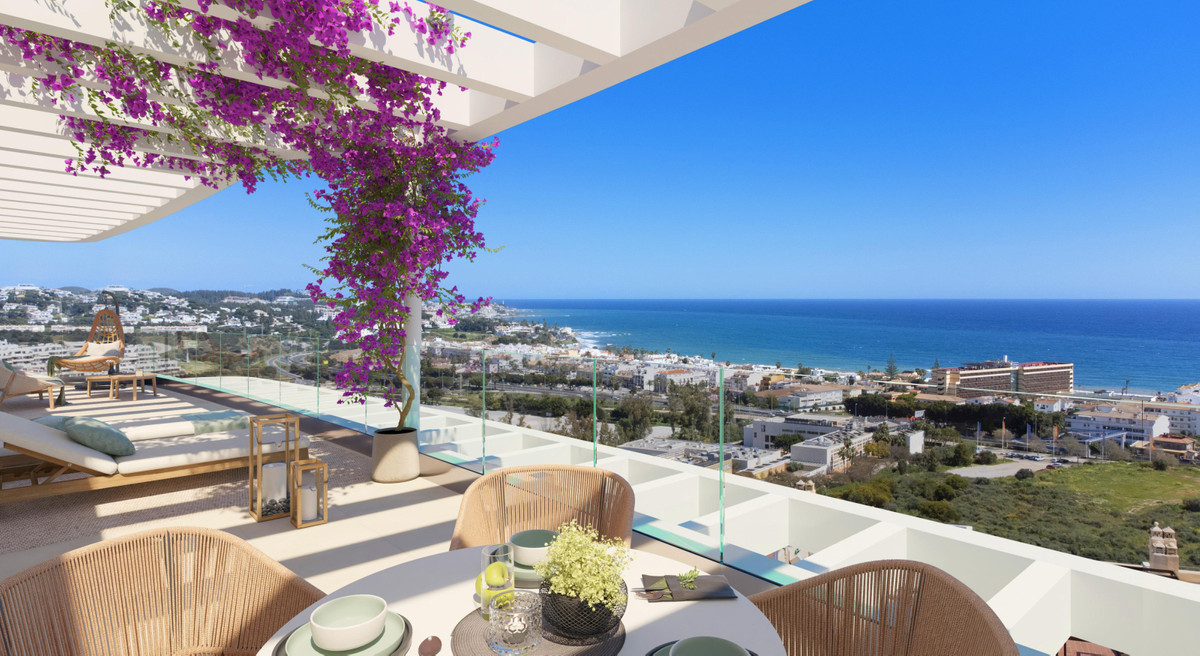 Royal Palms Mijas – FASE IV-4 – La Cala de Mijas - luxury terrace with bougainvillea, glass balustrade and panoramic sea views over La Cala coastline