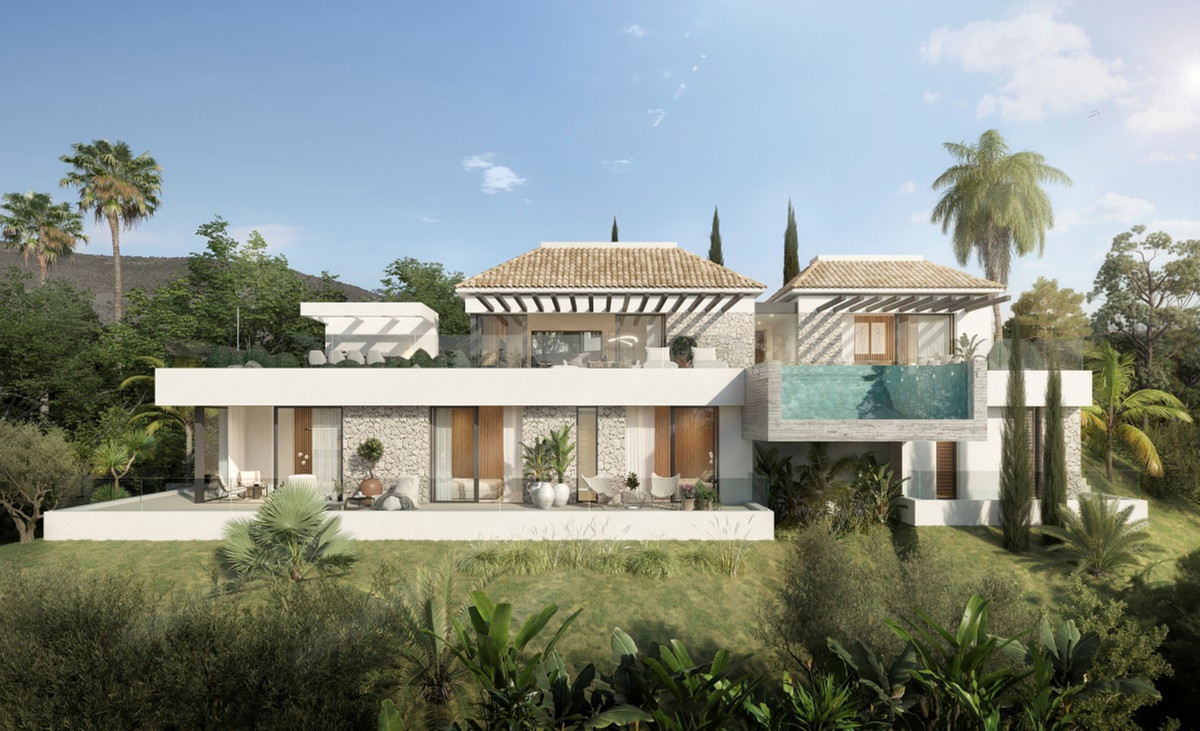 Villa ALHAMA de La Reserva – San Roque - exterior facade with elevated infinity pool, white render, stone cladding, and lush garden surroundings