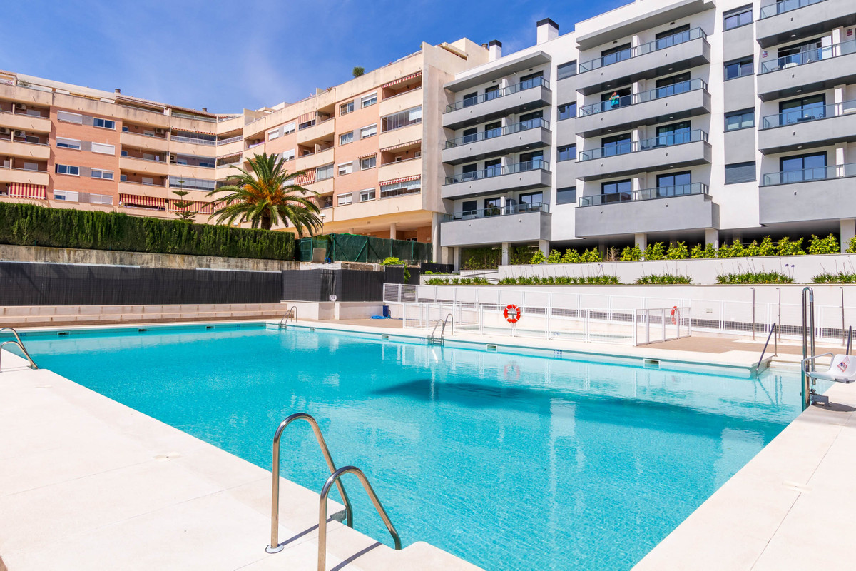 Suite Mijas I – Mijas - outdoor communal swimming pool with sparkling blue water and modern apartment building facade