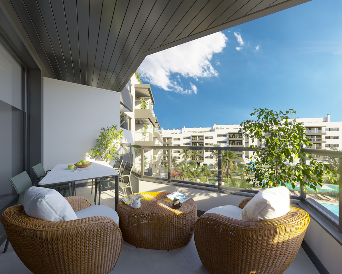 Suite Mijas III – Mijas - sunny terrace with rattan seating, pool view and white residential buildings beyond