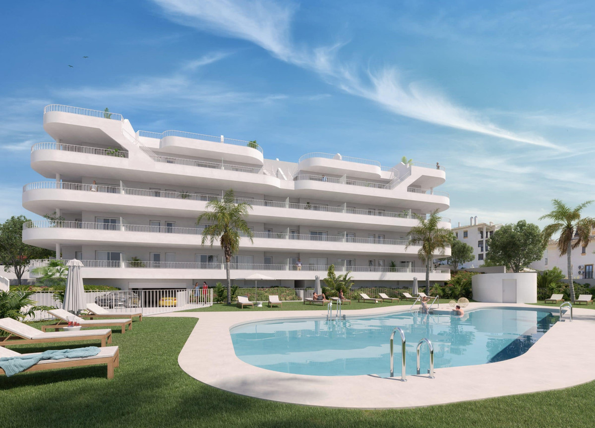 Sunset Views FASE II – Fuengirola - modern white apartment complex with communal pool, sun loungers and palm trees