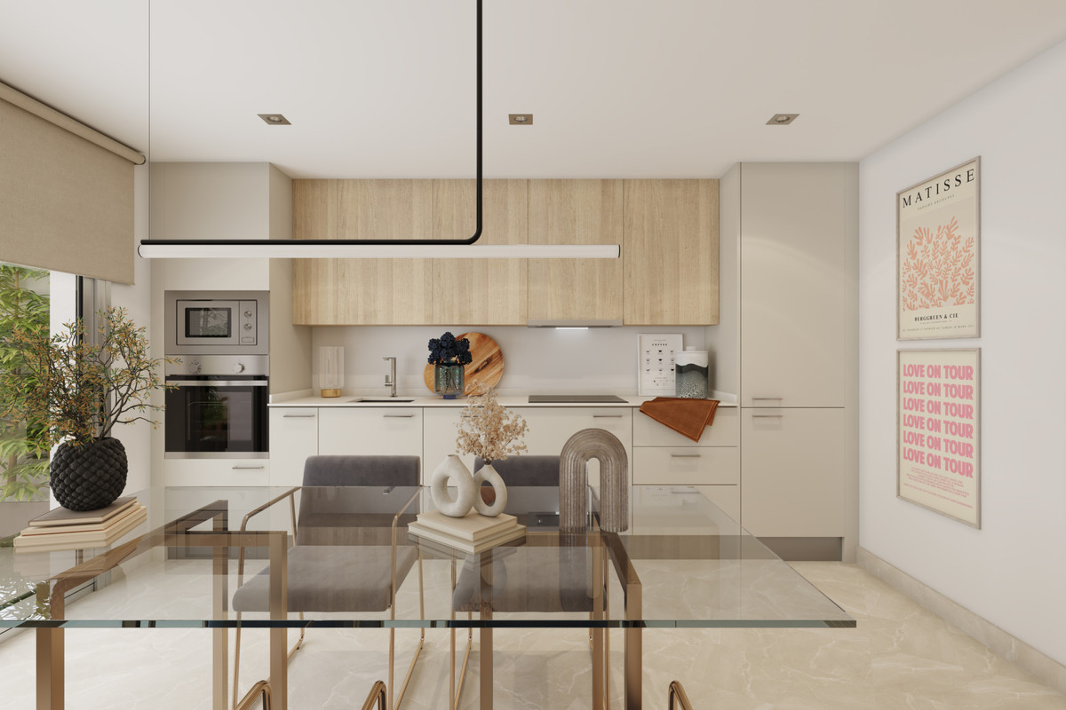 Valley Views – FASE 1 – Mijas - modern open-plan kitchen and dining area with light wood cabinetry and glass dining table